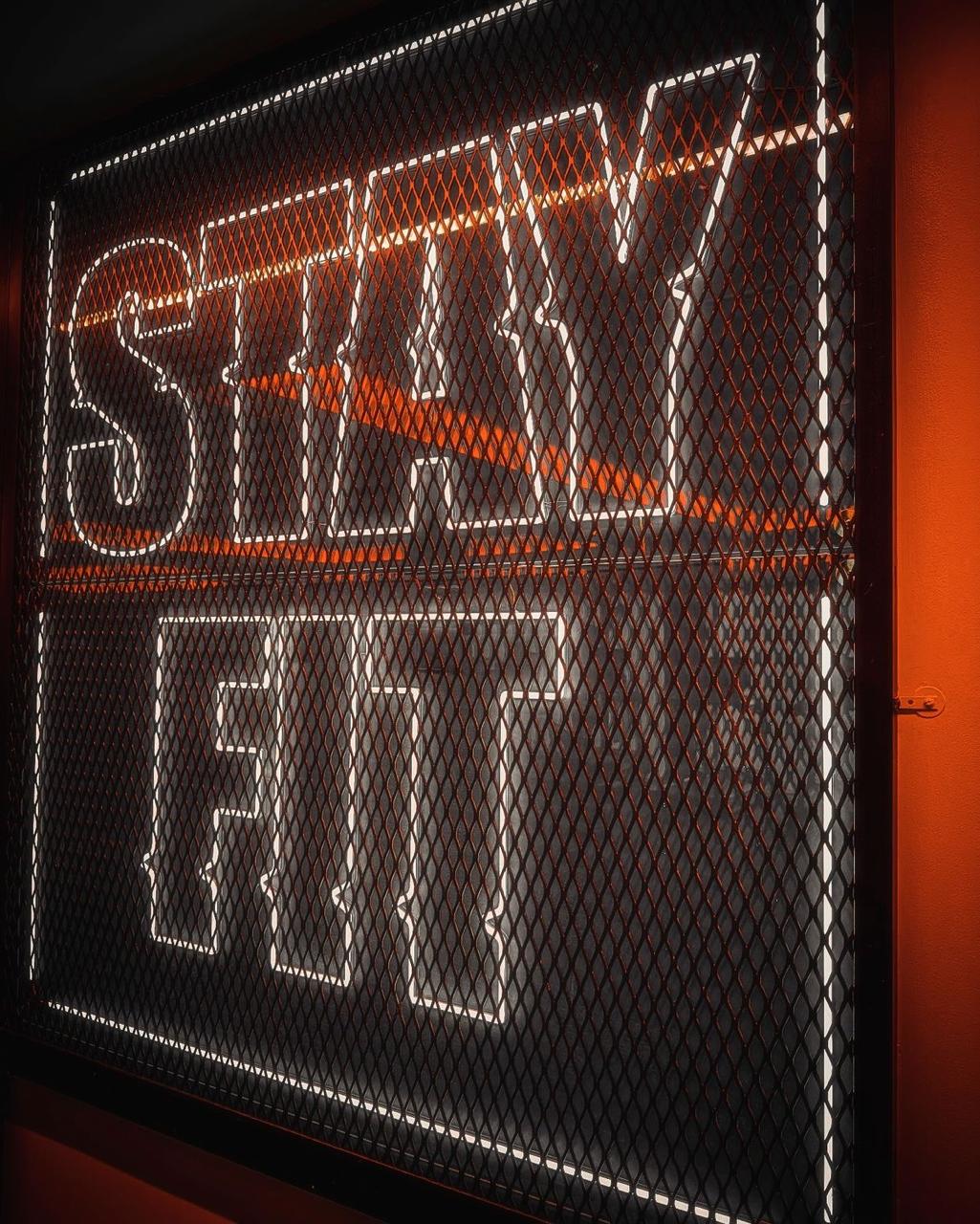 Signage panel — fitness studio feature wall